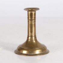 A GOOD AND SMALL WILLIAM & MARY BRASS TRUMPET BASE CANDLESTICK, CIRCA 1690.