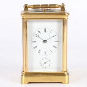 A 19TH CENTURY BRASS REPEATING CARRIAGE CLOCK, PROBABLY FRENCH.