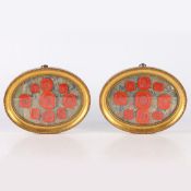 A PAIR OF FRAMED WAX SEALS, THE ARRAIGNMENTS WITH FIGURAL AND CLASSICAL RED SEALS.