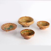 FOUR 17TH CENTURY DUTCH SLIPWARE POTTERY BOWLS/DISHES.