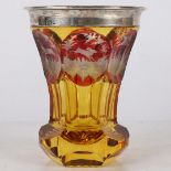 A 19TH CENTURY BOHEMIAN AMBER GLASS BEAKER, CIRCA 1880.