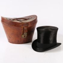 A VICTORIAN MOLESKIN TOP HAT WITH A LEATHER FITTED CASE.