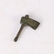 A ROMAN 3RD CENTURY AD VOTIVE BRONZE AXE.