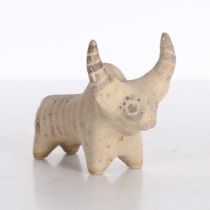 AN INDUS VALLEY TERRACOTTA FIGURINE OF A ZEBU BULL IDOL.