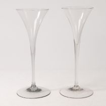 A NEAR PAIR OF EARLY 18TH CENTURY DUTCH FACON DE VENISE TALL 'PIPE STEM' TOASTING GLASSES (2).