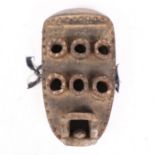 A GREBO KRU MASK, LIBERIA.