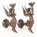 A PAIR OF BRONZE PATINATED WALL SCONCES IN THE FORM OF SIRENS.