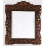 A 20TH CENTURY CANTON CARVED PRESENTATION PICTURE FRAME.