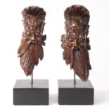 A PAIR OF CHINESE CARVED HARDWOOD HEADS.
