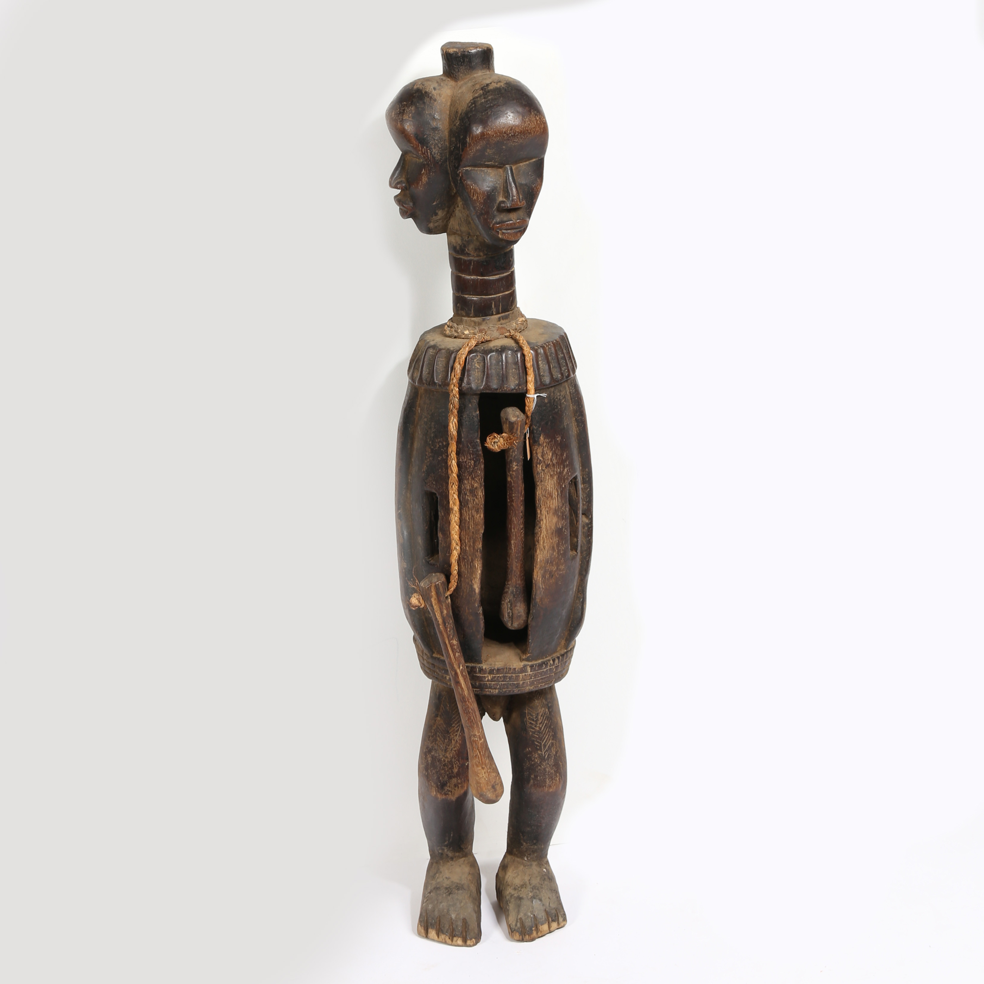 A DAN FIGURE SLIT DRUM, IVORY COAST/COTE D'IVOIRE.