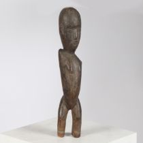 A LOBI THIL CARVED FIGURE, BURKINA FASO.