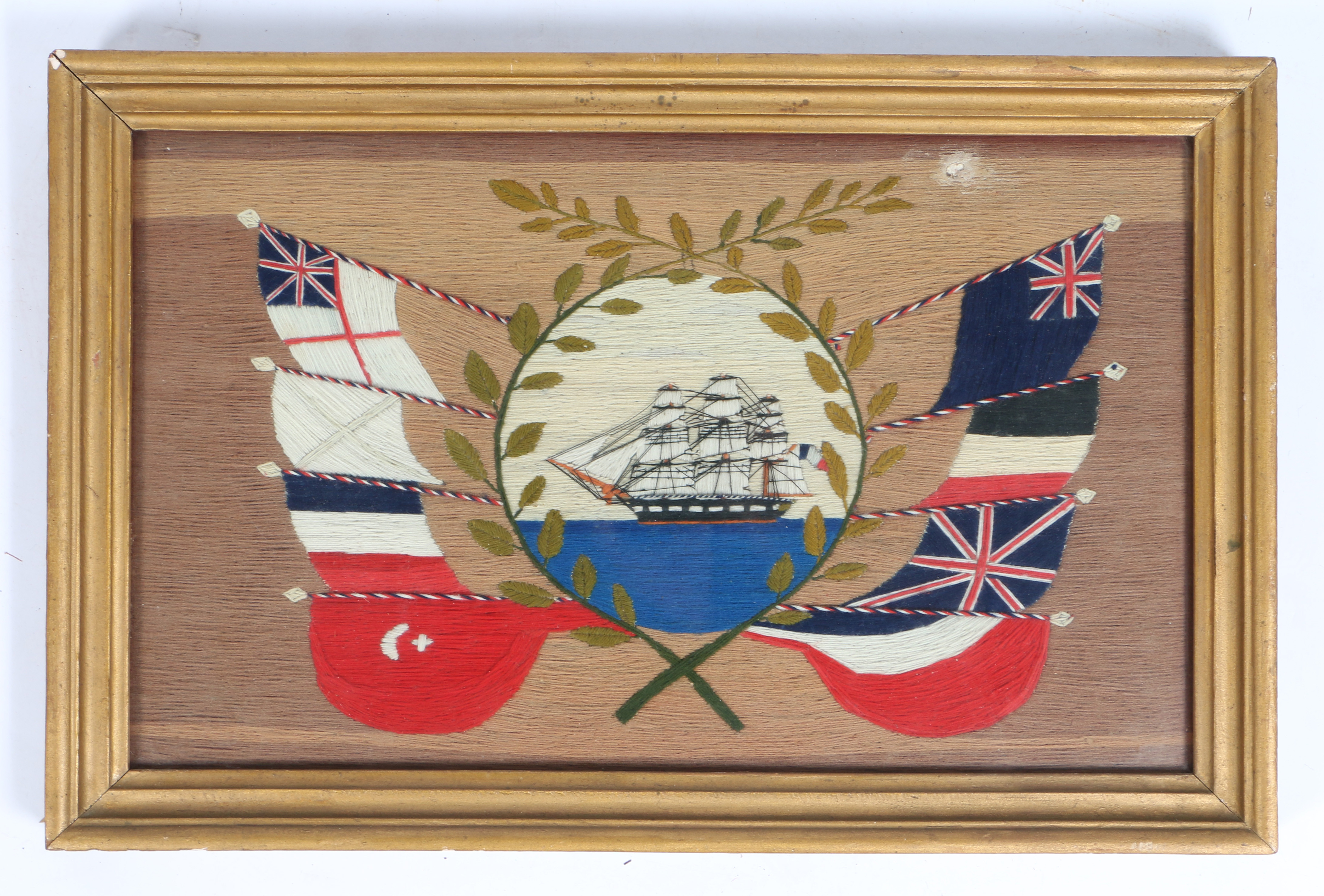 A 19TH CENTURY MARITIME WOOLWORK PICTURE.