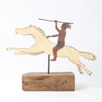 A 20TH CENTURY PAINTED NATIVE AMERICAN FIGURE ON HORSEBACK.