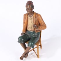 AN EARLY 20TH CENTURY BLOC POTTERY FIGURE.