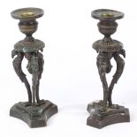 IN THE MANNER OF CHENEY OF LONDON A PAIR OF REGENCY BRONZE CANDLESTICKS.
