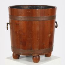 A TEAK AND COPPER BOUND BUCKET, PROBABLY MADE FROM THE TIMBER OF AN OLD SHIP.