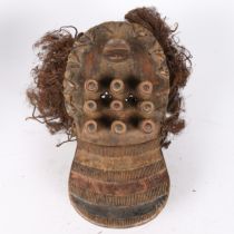 A GREBO KRU SHIELD MASK, LIBERIA.