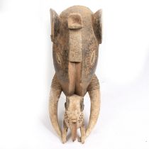 A LARGE BAULE ELEPHANT MASK, IVORY COAST/COTE D'IVOIRE.