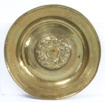 A MID-16TH CENTURY LARGE BRASS ALMS DISH, NUREMBERG, CIRCA 1550.