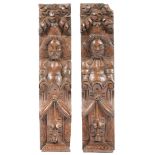 A PAIR OF ELIZABETH I CARVED OAK TERMS, CIRCA 1600.