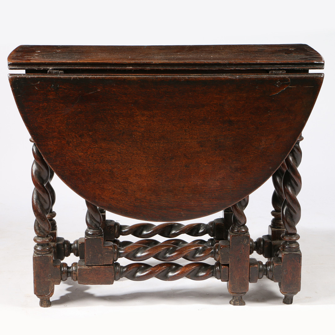 A CHARLES II OAK GATELEG TABLE, WITH SPIRAL-TURNED LEGS, CIRCA 1680.