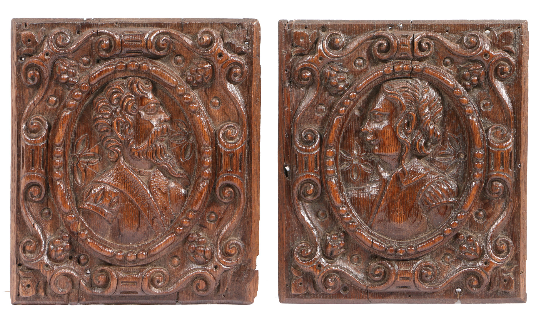 A PAIR OF LATE 16TH CENTURY CARVED OAK PORTRAIT PANELS, FLEMISH, CIRCA 1570.