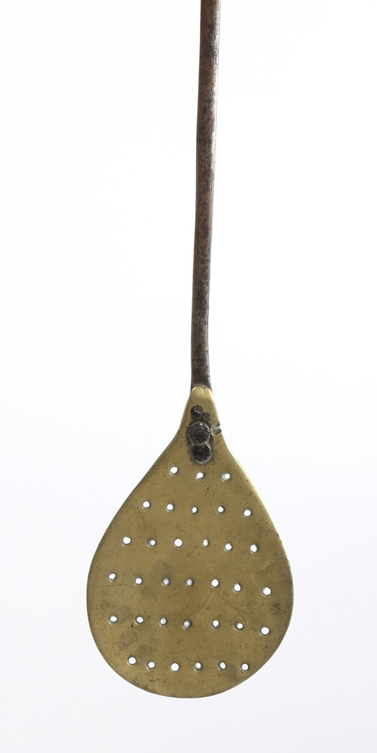 AN EARLY 18TH CENTURY PIERCED BRASS AND IRON 'PEEL', OR TURNER, ENGLISH, CIRCA 1720-50.