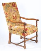 A WALNUT AND UPHOLSTERED OPEN ARMCHAIR, FLEMISH, CIRCA 1700.