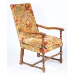 A WALNUT AND UPHOLSTERED OPEN ARMCHAIR, FLEMISH, CIRCA 1700.