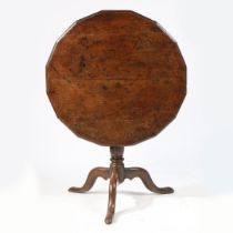 A RARE GEORGE II OAK MULTI-SIDED TRIPOD SUPPER TABLE, CIRCA 1740.