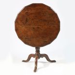 A RARE GEORGE II OAK MULTI-SIDED TRIPOD SUPPER TABLE, CIRCA 1740.