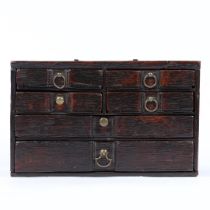 AN UNUSUAL SMALL BOARDED OAK TABLE-TOP CHEST OF DRAWERS, ENGLISH, CIRCA 1700-20.