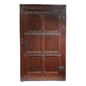 A CHARLES II OAK LIVERY/FOOD CUPBOARD, WITH PIERCED PANELLED DOOR, CIRCA 1660.