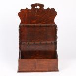 A GEORGE III OAK SPOON RACK, CIRCA 1780.