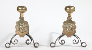 A PAIR OF BRASS AND IRON ANDIRONS/FIRE-DOGS, FLEMISH, CIRCA 1700.