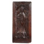 A 16TH CENTURY CARVED OAK PANEL, CIRCA 1540-80.