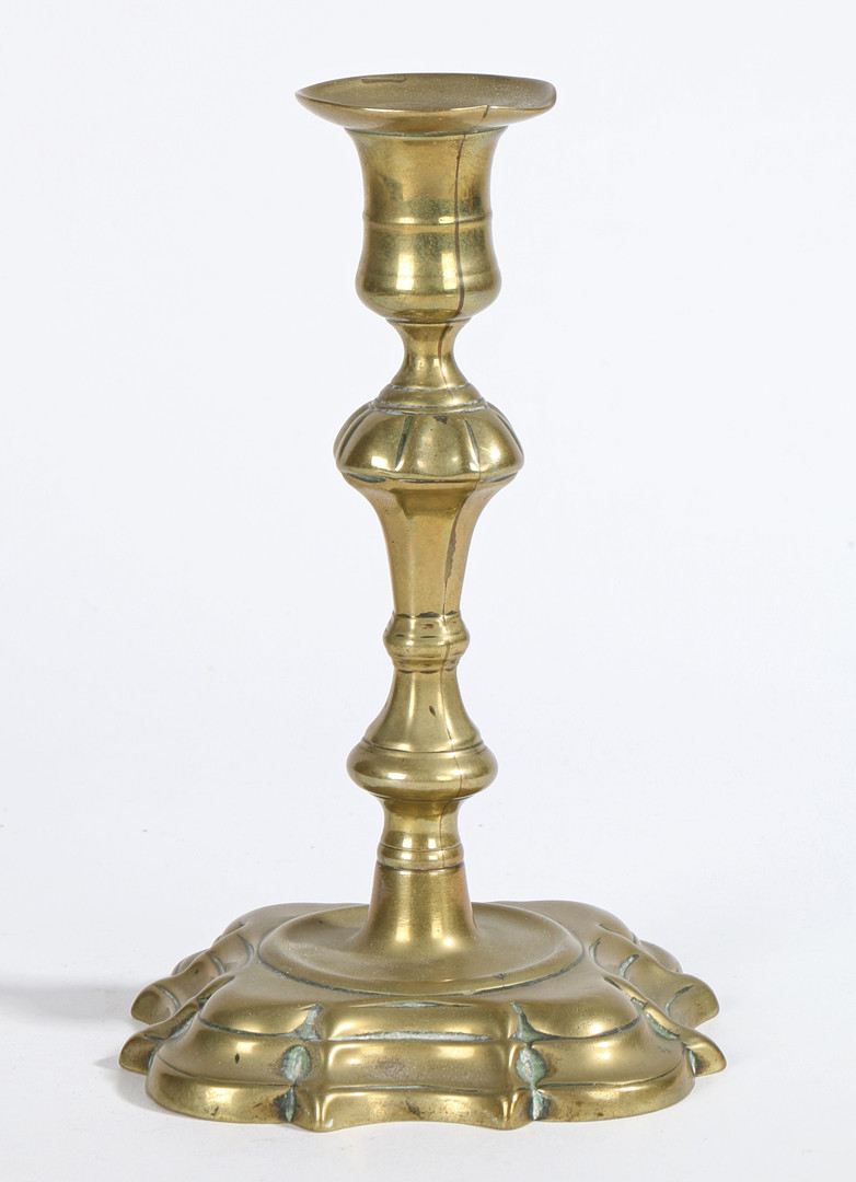 A GEORGE II BRASS SOCKET CANDLESTICK, CIR CA 1740.