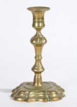 A GEORGE II BRASS SOCKET CANDLESTICK, CIR CA 1740.