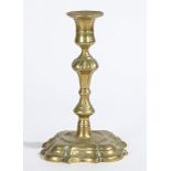 A GEORGE II BRASS SOCKET CANDLESTICK, CIR CA 1740.