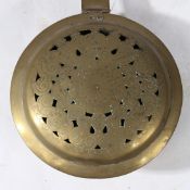 A BRASS AND IRON WARMING PAN, DUTCH, CIRCA 1700.