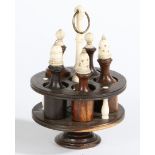 A TOY LIGNUM VITAE AND BONE CONDIMENT CAROUSEL, POSSIBLY 18TH CENTURY.