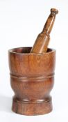 A GEORGE III LIGNUM VITAE PESTLE AND MORTAR, CIRCA 1800.