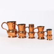 A GROUP OF FIVE 19TH CENTURY COPPER THISTLE- AND BALUSTER-SHAPED MEASURES, SCOTTISH.