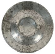 A FINE AND RARE CHARLES II PEWTER BROAD RIM AND BOSSED DISH, ENGRAVED WITH THE ARMS OF THE WORSHIPFU