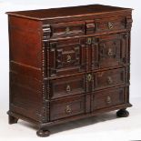 A CHARLES II OAK GEOMETRIC CHEST OF DRAWERS, WITH RARE 'SECRET' DRAWER, CIRCA 1680.