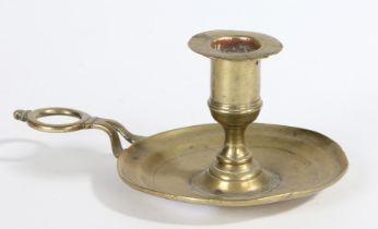 A CHARMING GEORGE I BRASS CHAMBERSTICK, CIRCA 1720.