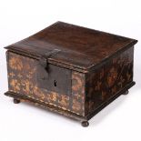 A RARE CHARLES II BOARDED OAK AND STRAW-WORK DECORATED BOX, CIRCA 1680.