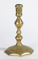 A GEORGE I BRASS SOCKET CANDLESTICK, CIRCA 1720.