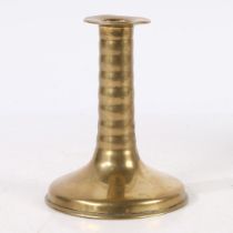 A RARE CHARLES II BRASS TRUMPET-BASE SOCKET CANDLESTICK, CIRCA 1675.