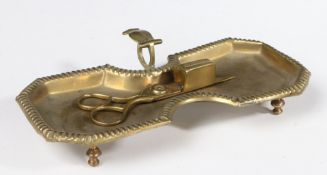 A PAIR OF EARLY 19TH CENTURY BRASS CANDLE-SNUFFERS AND TRAY (2).
